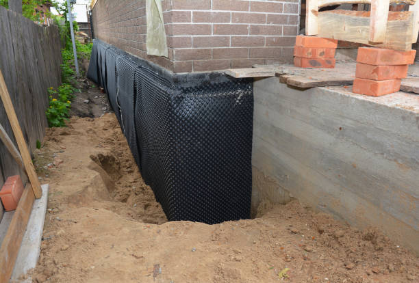 SJ Waterproofing Pros technician performing targeted Waterproofing assessment in Burr Oak, MI